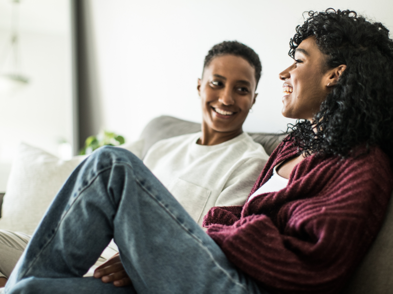 Lesbian Couple Relaxing On Couch Lesbian Couple Relaxing On Couch