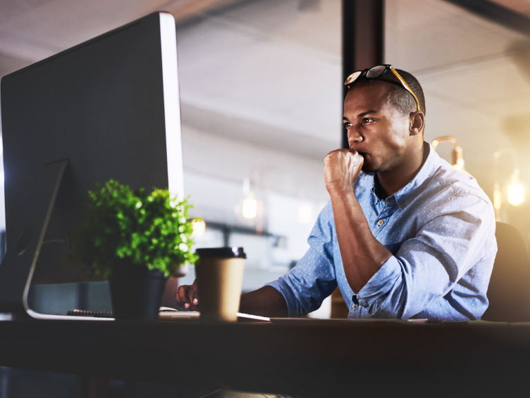 man focused on computer work